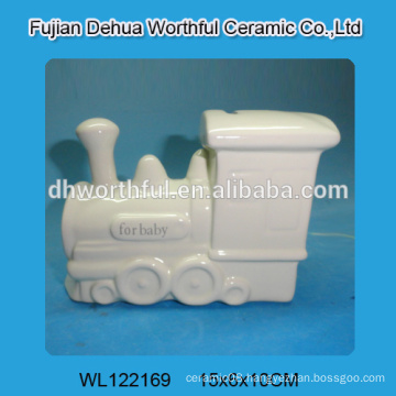 White ceramic piggy bank in train shape for kids